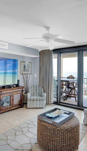 Bright living room with ocean view balcony at Wind Drift 208 in Orange Beach