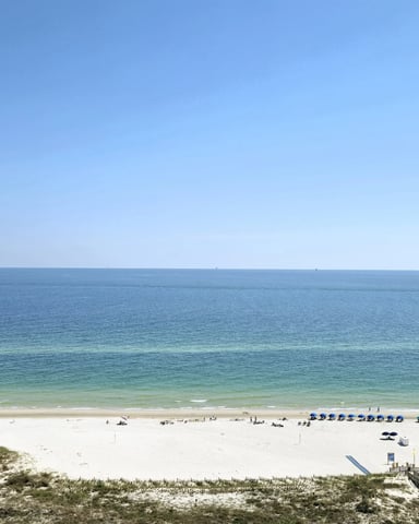 Aerial view of white sand beach and turquoise Gulf water